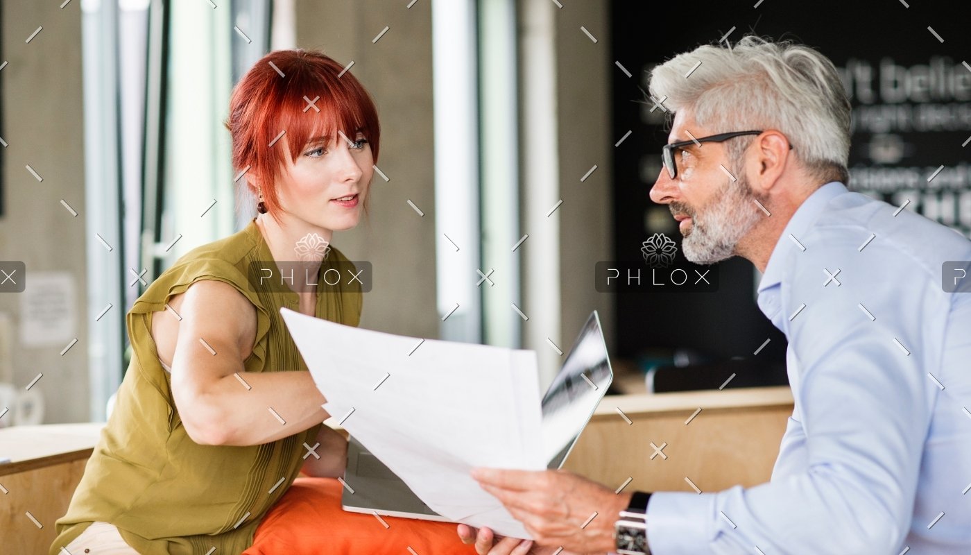 business-people-in-creative-office-consulting-a-P48WVT9